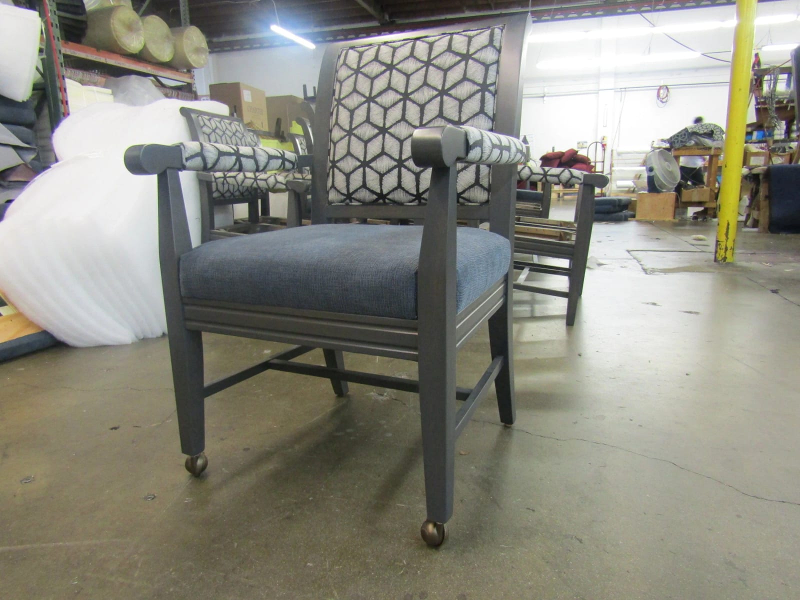 Dining armchairs with patterned backs and casters
